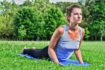 Young woman during yoga meditation in the park