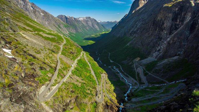 Timelapse of mountain road Trollstigen traffic. View to the serpentine with cars. Norway trip. Nature background. Holidays destination. Good for for Scandinavian tourism presentation.