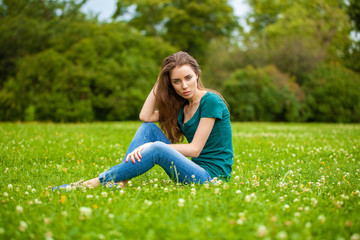 Young beautiful brown haired woman in blue jeans