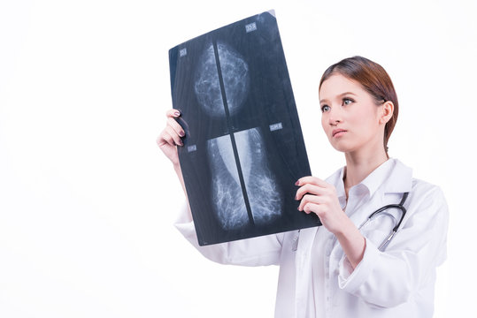 Female doctor checking mammogram x-ray film isolated on white background. image with clipping path