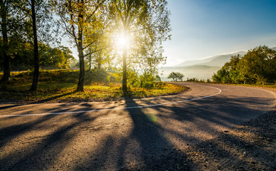 mountainous countryside road at sunrise