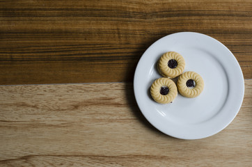 coffee and cookie on wooden table