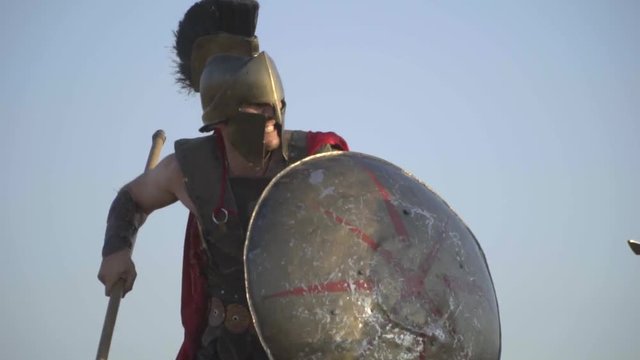 Terrible Roman legionary fights attacks with shield and spear