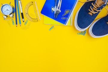 back to school border - blue shoes with school supplies