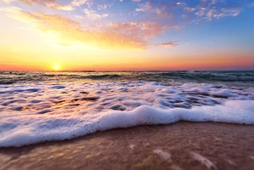 Poster de jardin Mer / coucher de soleil Majestic ocean sunset with a breaking wave.