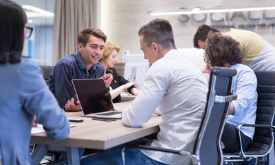Startup Business Team At A Meeting at modern office building