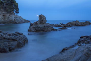 Night coastal shot with rocks, long exposure picture from Costa Brava, Spain