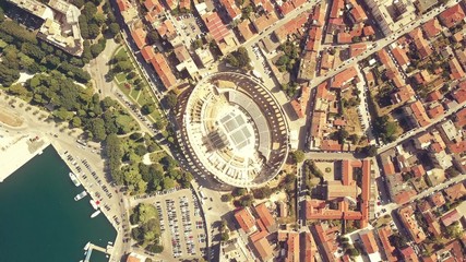 Aerial top down view of Pula city and famous ancient Roman arena in Croatia, one of the most popular Croatian landmarks