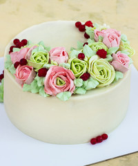 Birthday cake with flowers rose on light background