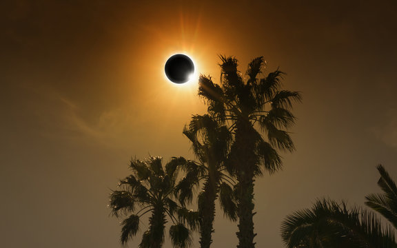 Total solar eclipse in dark glowing sky