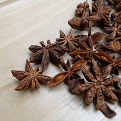 Star anise as displayed on wooden background
