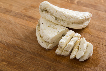 Homemade dairy, soft cheese, milk product on wood