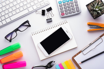 White office desk table with school accessories with office supplies. Top view with copy space