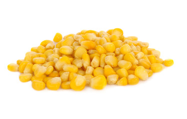 Pile of yellow corn kernels isolated over the white background