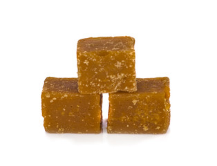 ugarcane Hard Molasses or Jaggery and sugar in scoop on white background