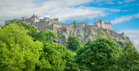 Fototapeta na wymiar Edinburgh Castle in a summer afternoon as seen from Princes Street Gardens, Scotland.