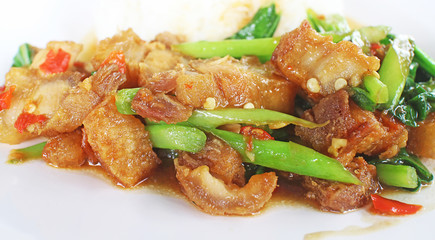 Crispy pork with kale.