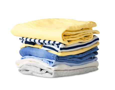 Folded stack clothes isolated on white.
