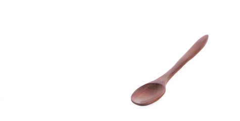 Used wooden spoon isolated