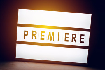 Vintage illuminated Premiere sign in cinema movie