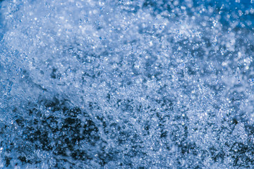 Splashes of water from the movement of boats on the river in natural light