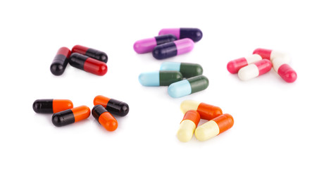 Drug prescription for treatment medication. Pharmaceutical medicament, cure in container for health. Pharmacy theme, Heap of red orange white round capsule pills with medicine antibiotic in packages.