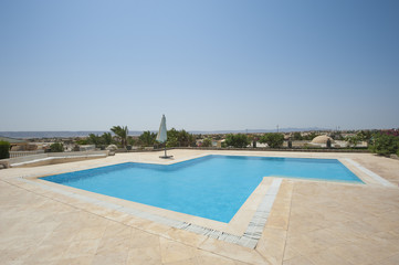 Fototapeta na wymiar Swimming pool at at luxury tropical holiday villa