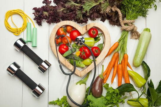 Fresh Vegetables. Diet, A Healthy Lifestyle. Sport, Dumbbells And A Skipping Rope On A White Background