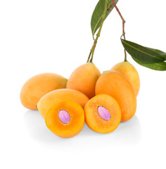 Pile of Bright Orange Yellow Ripe Marian Plums Isolated on White Background