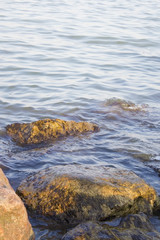Boulders and the sea at sunset