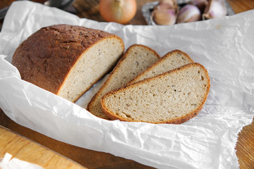Farmer bread on baking paper, Vintage country table