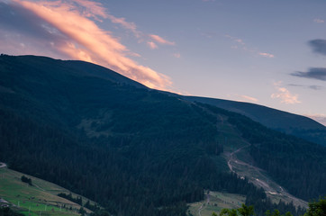 Obraz premium Background with Ukrainian Carpathian Mountains during the sunset in the Pylypets