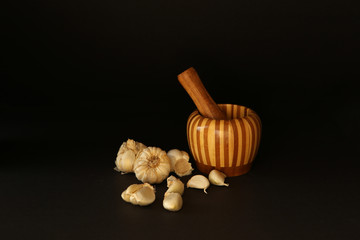 Fototapeta na wymiar Garlics on the black background