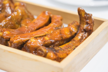 BBQ Pork spare ribs on wooden tray