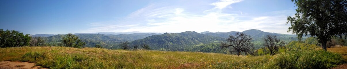 Panoramic view of the Sierra Nevada mountains from a hilltop in spring time. Near Sequoias National Park.