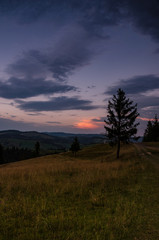Obraz premium Background with Ukrainian Carpathian Mountains during the sunset in the Pylypets