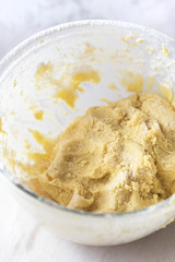 MIxing baking ingredients in a bowl for cake or pancakes. Light food photography concept