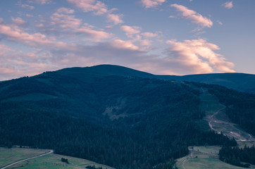 Background with Ukrainian Carpathian Mountains during the sunset in the Pylypets