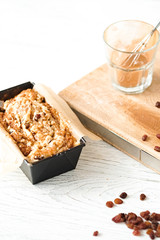 Raw cinnamon loaf cake dough in a pan. Step by step baking preparation process. White food photography