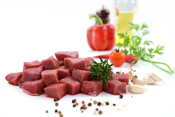 Raw meat, beef steak sliced in cubes isolated on white background