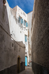 Narrow street and colorful old houses of medieval medina of Essaouira, Morocco