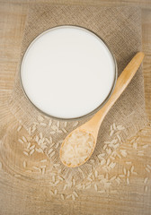 Rice milk on the wooden background .