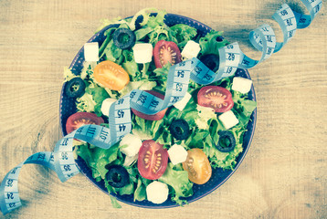 Greek salad with fresh vegetables, feta cheese and black olives.