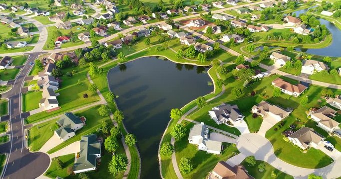 Beautiful neighborhoods around man-made lake, aerial view
