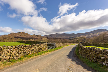 Road through the countryside in The Lake District National Park, Cumbria, England