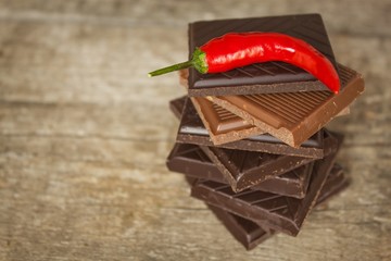 Dark chocolate and red chili peppers. Selling spicy chocolate. Crazy taste.