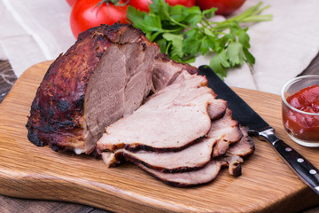 Roast pork with herbs and vegetables.