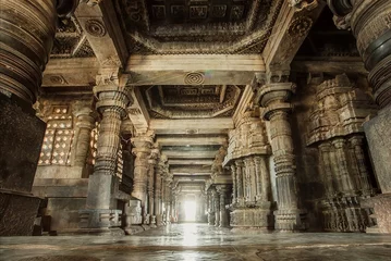 Wall murals Place of worship Columns and empty corridor inside the 12th century stone temple Hoysaleswara, now Karnataka state of India