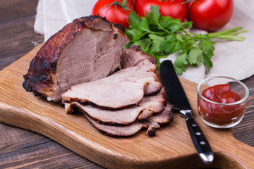 Roast pork with herbs and vegetables.