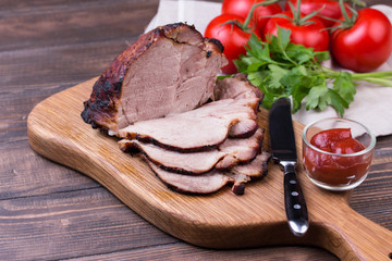 Roast pork with herbs and vegetables.